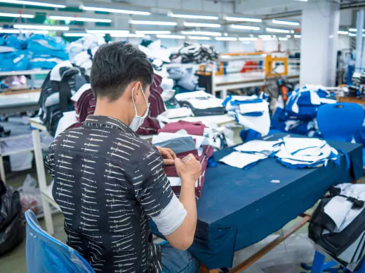 two-asian-man-wearing-medical-mask-writing-number-fabric-after-finished-cut-textile-cloth-factory-working-process-tailoring-workers-equipment